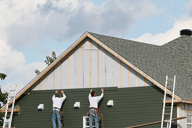 Professional Emergency Siding Repair technician working in Holmesville, OH